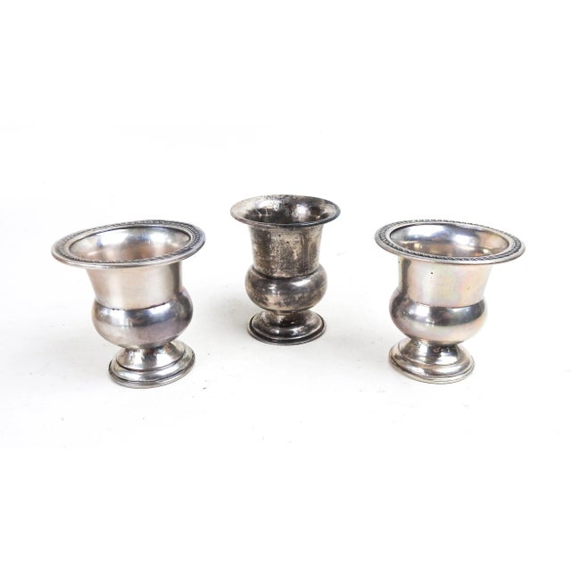 Group of 3 small mismatched sterling silver urn shaped match or toothpick holders. Two match, all marked sterling. Overall...