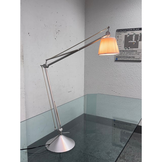 Design Plus Gallery presents the Archimoon K Table Lamp from Flos by Philippe Starck. This table lamp with a silk shade is...
