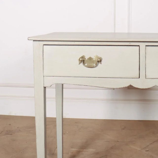 19th C two drawer English painted pine lamp table. 1890. This piece is designed in the style of the selected designer...