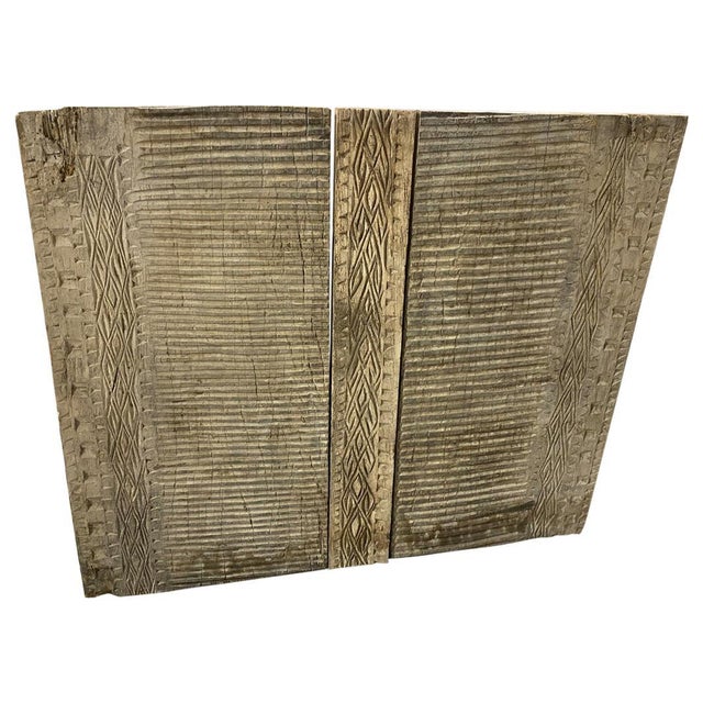 Antique hand carved architectural panel from Toraja. This carving symbolizes the protection of the home and fertility....