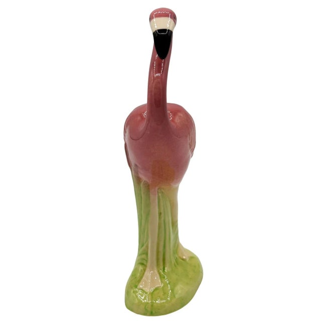 Mid-century pink and green "Curious Watcher" flamingo ceramic figurine made by the Metlox pottery company. The statue...
