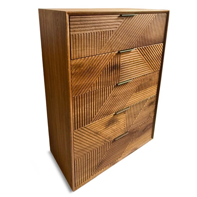 Modern warm walnut stained oak wood tall dresser with five spacious drawers. Geometric carved lines on drawers. Antiqued...