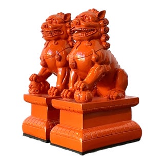Vintage Lacquered Orange Foo Dogs - A Pair For Sale
