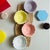 This four-piece set of dipping dishes features a flower-shaped design with realistic texturing on the bowls, making them...