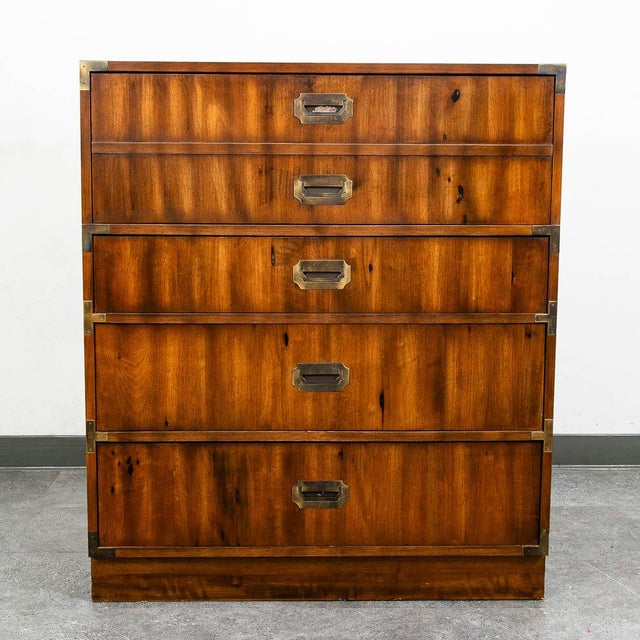 American designed highboy dresser by Kroehler. This piece features four drawers and brass detailing throughout. Marked...
