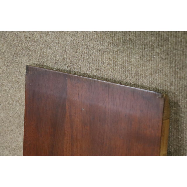 Mid-century modern rounded dining table with 10" leaf. Extending to almost 6 feet long and accommodating 6 chairs.