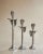 Bring sculptural elegance to your home with this striking set of three vintage pewter calla lily candleholders. Featuring...