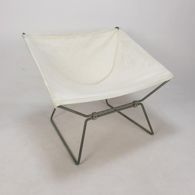 This stunning ap-14 "anneau" chair is designed by pierre paulin. it is manufactured by ap polak in the 50's. the dual...