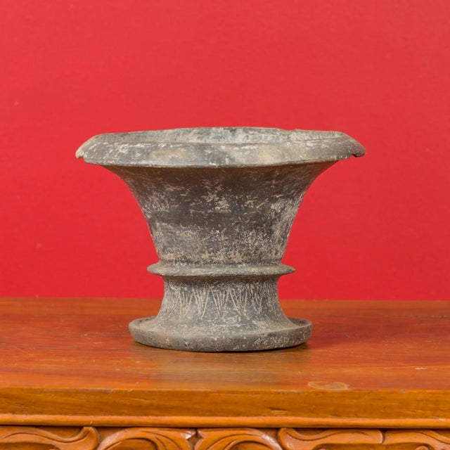 Chinese Han Dynasty hard terracotta vessel circa circa 202 BC-200 AD, with flaring neck and incised motifs. Created in...