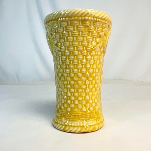 We love the color of this vase - canary yellow. This comes from Italy out of the 1950s. It’s a pressed ceramic vase with...