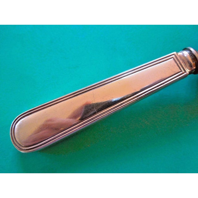 This pie server is part of the classic Hamilton pattern by Tiffany & Co. It features a sterling Silver handle and a...