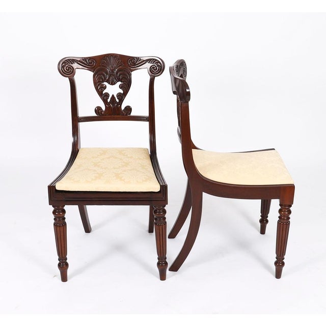 A superb set of twelve Irish George IV, Regency Period, flame mahogany dining chairs, Circa 1825 in date. The set...