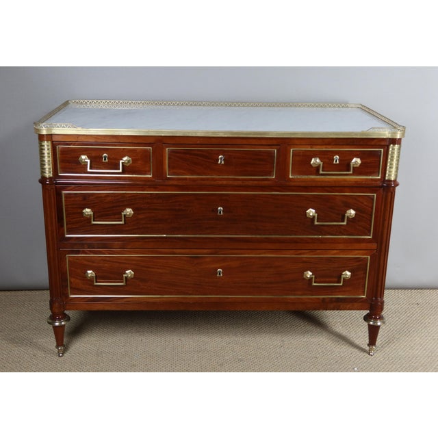 Louis xvi period chest of drawers in mahogany and mahogany veneer on an oak frame. It opens with five drawers in three...