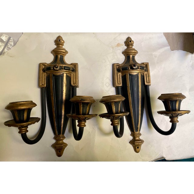 This is a great looking pair of neoclassical style sconces with a streamlined urn shape in the center and Greek Key...