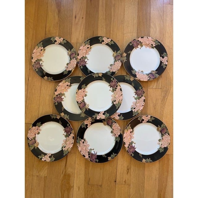 This pattern was produced for Fitz and Floyd from 1984-1996. These 7.5” salad plates feature a black rim on white with a...
