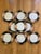 This pattern was produced for Fitz and Floyd from 1984-1996. These 7.5” salad plates feature a black rim on white with a...