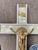 This is a vintage 1960s crucifix featuring a gold-colored metal corpus on a faux mother of pearl celluloid cross. The...