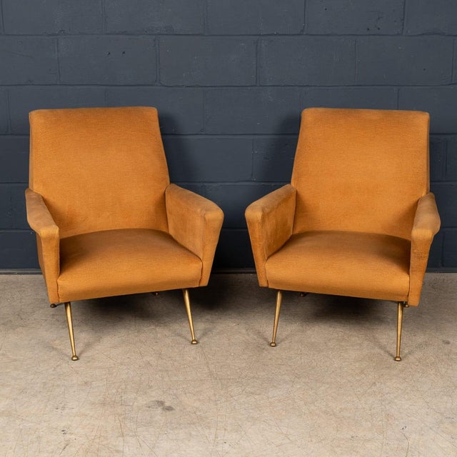 A refined pair of Italian Mid-Century Modern lounge chairs dating from the 1950s or 60s, a period defined by elegance,...