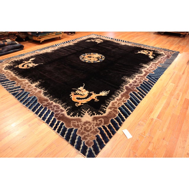 Antique Chinese Black and Gold Peking Dragon Motif Rug, Country of Origin: China, Circa Date: 1920
