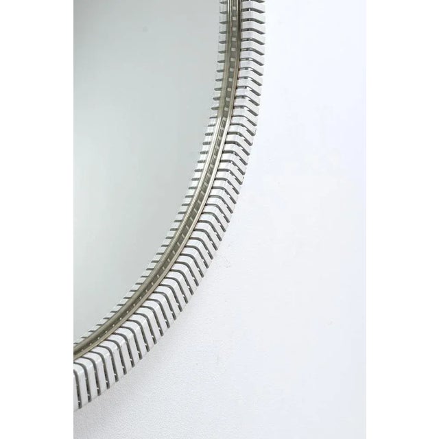 Mirror with metal edge. in good vintage condition. Measurements Ø 85 cm; D. 3 cm.