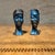 For your consideration, a pair of blue and gold-toned bust figurines depict a man and a woman in a stylized, artistic...