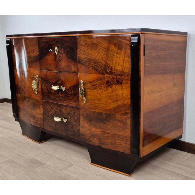 A rare venetian art deco sideboard in fine woods such as burl and walnut plume and trim in blonde walnut, with rosewood...