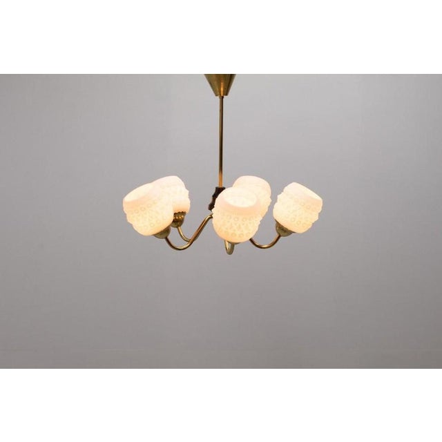 Beautiful Swedish brass ceiling lamp with 5 white crystal shades from 1950s. Condition Good, age related marks. I have...