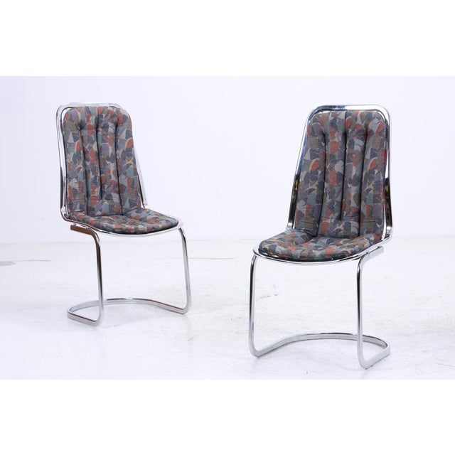 A beautiful set of two cantilever chairs from Gastone Rinaldi with a clean, light design and chrome-plated frame. The...