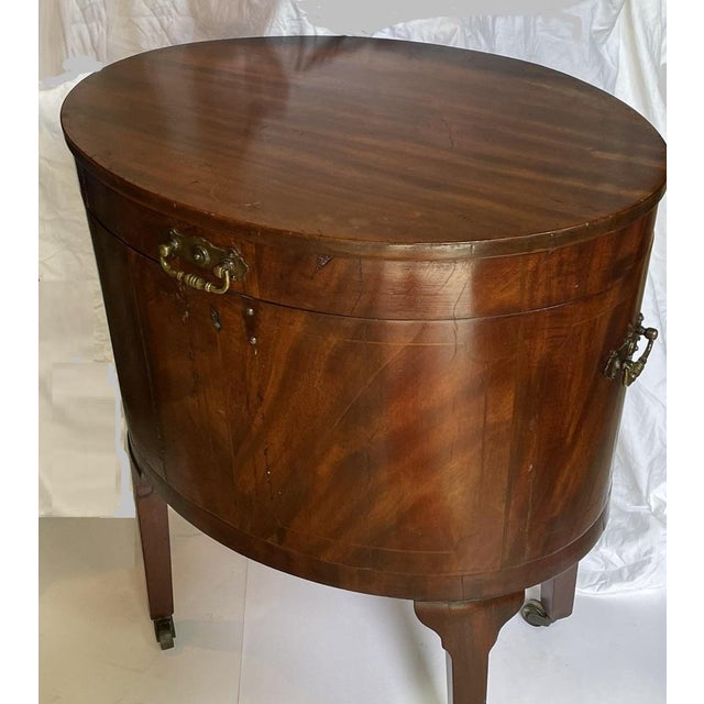 A Toast to Timeless Elegance Step into the refined world of Regency-era England with this exquisite Georgian cellarette, a...