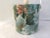 Lovely sea foam green and rose floral vinyl wrapped ice bucket featuring a white hard plastic levered handle and clear...