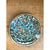 This vintage ceramic plate is densely hand-painted with an all-over floral pattern set against a creamy white ground....