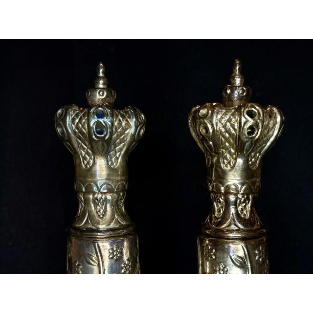 Here is an attractive pair of vintage , sterling silver scroll cases with besamim crown tops filled with cloves, and...