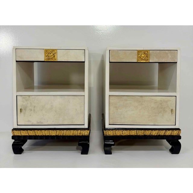 A striking and sophisticated pair, combining the luminous warmth of parchment with the bold contrast of black lacquer and...