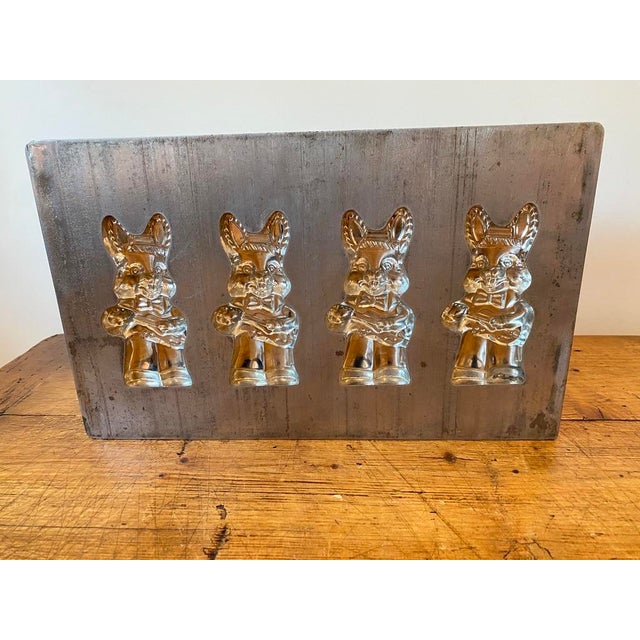 Charming Vintage Heavy Aluminum Four Slot Bunny Chocolate or Cookie Mold. The bunnies are holding a guitar or ukulele -...