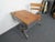 Vintage classroom desk and chair that has been beautifully refinished. The chair rests on a swiveling base, and the...