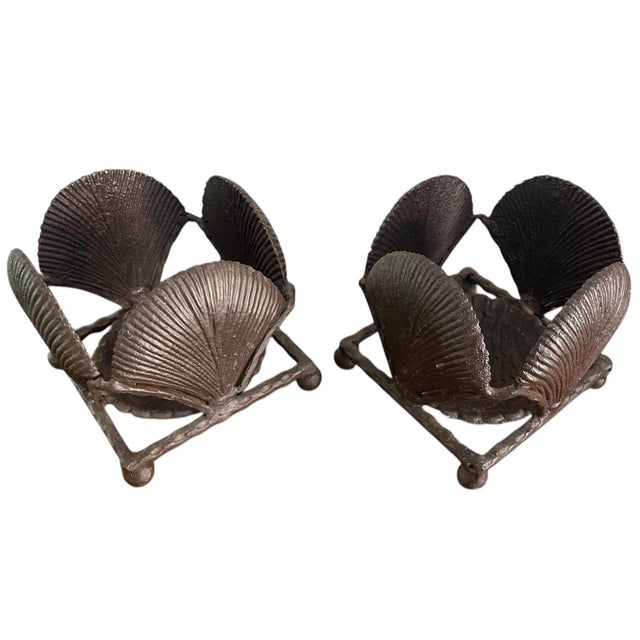 Striking pair of vintage cast metal candle holders featuring a sculptural shell motif within a geometric cube form. The...