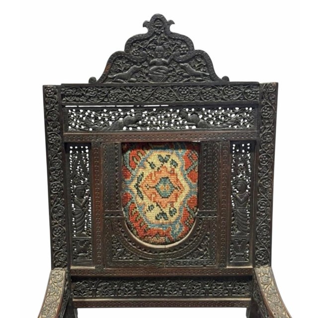 An extraordinary hand-carved ceremonial armchair exhibiting the rich decorative traditions of the Eastern Mediterranean...