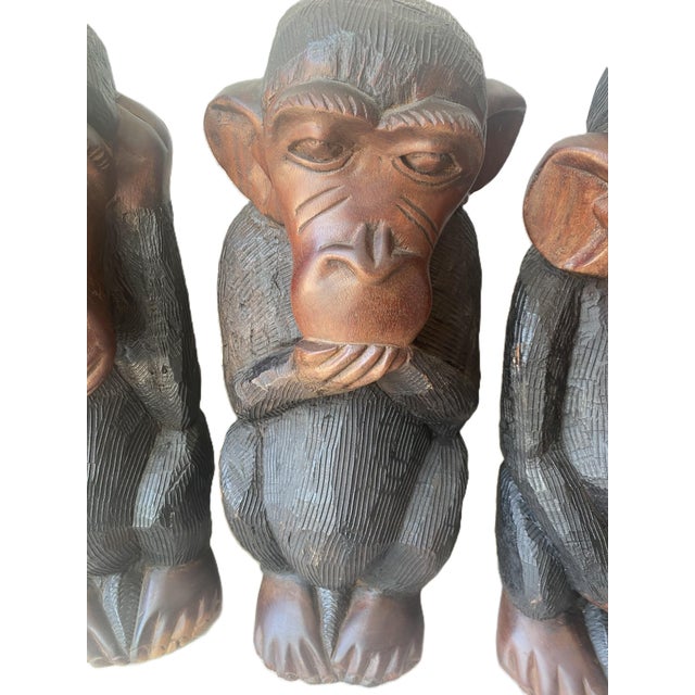 This Vintage, large hand-carved three wise monkeys statue set with a rare fourth monkey is a unique and collectible...