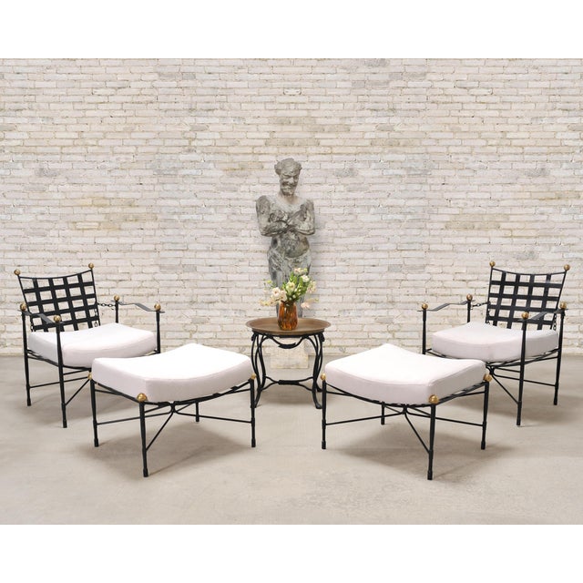 An iconic and rare pair of "Amalfi" lounge chairs and matching ottomans with adjustable chain backs. The stylish mid-...