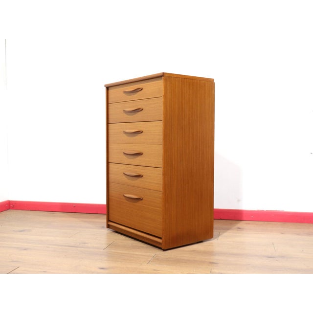 A beautiful tall dresser by renowned British furniture maker Austinsuite, this Mid Century Modern vintage teak chest...