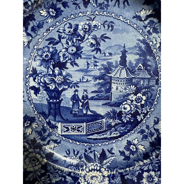 Antique blue and white plate by Ridgways with a Chinoiserie design. Backstamp reads "Ridgways; Asiatic Palaces". *stand...