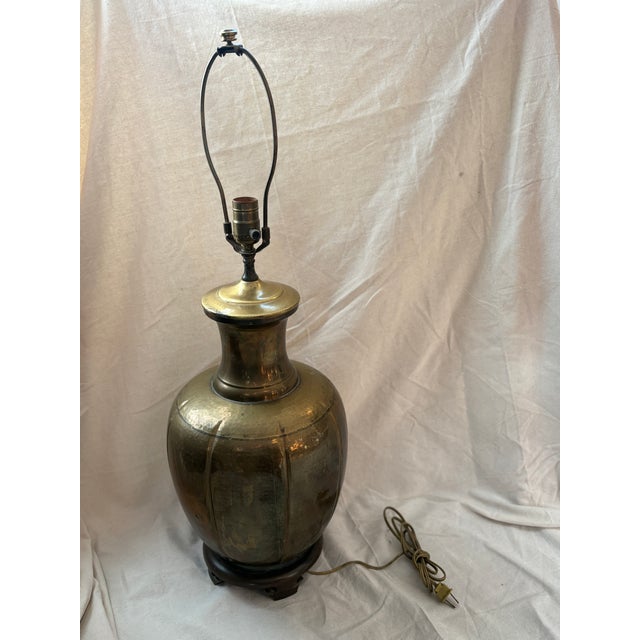 A substantial mid-century brass table lamp in classic ginger-jar form, dating to the 1950s. The hand-formed brass body...
