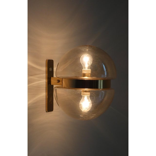 Space Age-style wall lamps by Peill & Putzler, made in Germany in the 1960s. Characterized by this geometric double-capped...