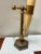 This is a neoclassical style desk or table lamp that is a faux horn mounted to a brass support. It is adjustable by the...