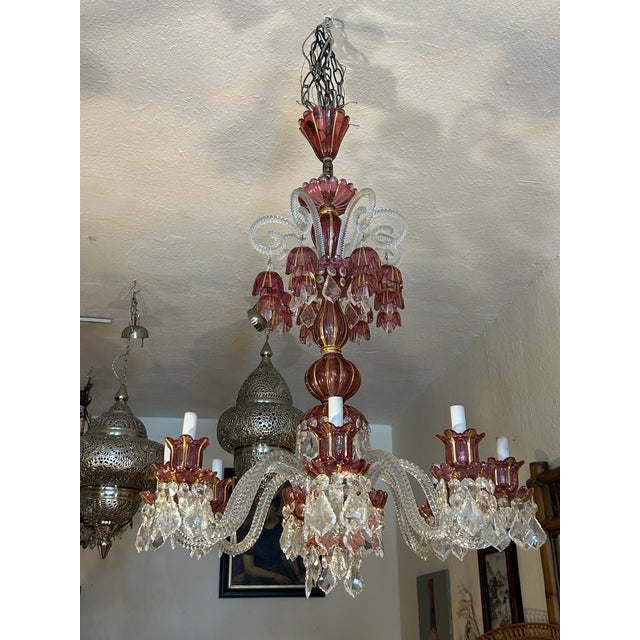 Striking Antique Italian chandelier featuring hand blown raspberry pink bulbs, cups and flowers having gold accents with...