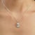 Add a touch of understated elegance to your jewelry collection with this baguette-cut aquamarine pendant charm, featuring...