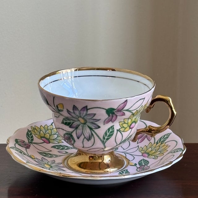 Offering a lovely vintage Rosina Bone China teacup and saucer made in England. This elegant mid-century tea cup features a...
