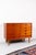 This high-quality chest of drawers from the Danish furniture manufacturer Erik Brouer stands out with its warm teak tone...