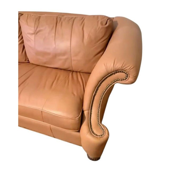 The Epitome of Timeless Luxury: The Lexington Leather Sofa Transform your living space with this breathtaking statement...