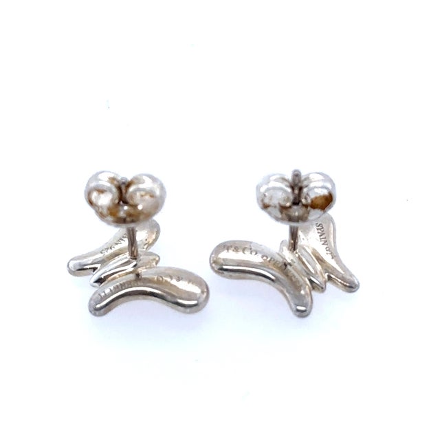 A rare pair of Tiffany & Co. Elsa Peretti Butterfly stud earrings crafted in sterling silver, featuring delicate...